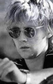 ⇢ ROGER TAYLOR