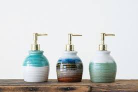 Popular materials include glass, chrome, ceramic, marble, porcelain, teak, stoneware and plastic. Ikeda Stoneware 3 Piece Bathroom Accessory Set Bathroom Accessory Set Lotion And Soap Dispensers Bathroom Accessories