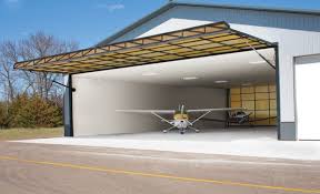 Aviation Hangar Doors Hydraulic Hangar Doors Folding Doors Bi Fold Hangar Doors Overhead Doors High Clearance Doors Airplane Hangar Architecture Hangar