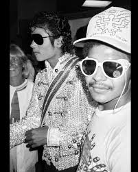 Jean-Michel is seen here with actress Rosanna Arquette at Madison Square  Garden, where they joined a vibrant mix of artists and cultural  personalities—including Keith Haring, Kenny Scharf, Sean Lennon, and Little  Angel—to