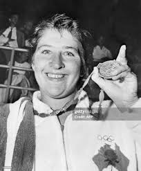 Dawn Fraser from Australia shows her gold medal that she won at the... News  Photo