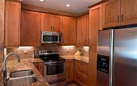 To give it a modern update, plain white solid surface was used for the counter tops, creating clean & seamless look which is a nice contrast against the wengue cabinets. Birch Kitchen Cabinets Kitchens With Birch Cabinets Accent Building Products