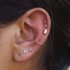 These Are A Few Of My Favorite Things Helix Piercing Featuring A Rose Gold Baguette And High L Types Of Ear Piercings Different Ear Piercings Crystal Ear Cuff