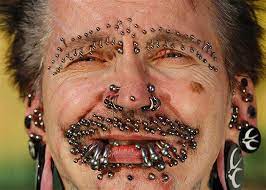 Image Guinness World Record Holder For The Most Pierced Man Rolf Bucholz Of Germany Poses Showing Some Of His Crazy Piercings Facial Piercings Piercing