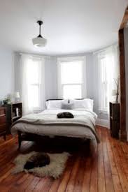 A bay window is a window space projecting outward from the main walls of a house and forming a bay in a room, either square or polygonal in plan. How To Arrange A Bedroom With A Bay Window 5 Tips For Comfortable Space Home Improvement Day
