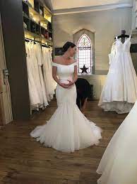 The absolute cleavage accentuates this plus size model's beautiful bust, while the flowing silhouette makes her appear a bit taller. Wedding Dress Shopping The Realities Of Wedding Dress Shopping If You Have Big Boobs
