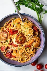 Then, add the minced garlic to the pan and stir it in with a spoon or spatula. Scallop Shrimp Pasta With Burst Cherry Tomatoes Delightful Plate