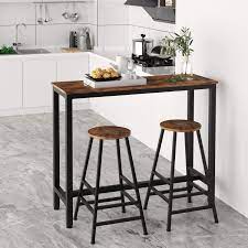 This unique bar set includes a round bar table and two stools. Amazon Com Ironck 2 Piece Pub Bar Table Set 47 2 L 15 7 W 39 4 H Industrial High Top Table With Bar Stool Chair Mdf Board And Metal Vintage Brown Kitchen Dining