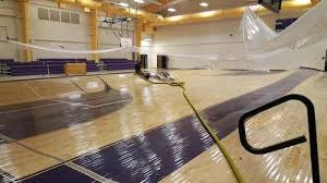Flooded Middle School Gym Floor Becomes Hulking Waves Of Maple Wood Floor Business Magazine Gym Flooring Maple Wood Flooring Wood Floors