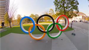 The japanese flag is raised over the main olympic stadium in tokyo during the opening ceremony. Tokyo Olympic Stadium 2020 2021 Japan Reference
