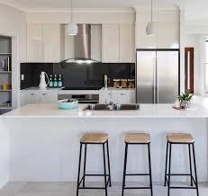 Even a small wine rack is fitted into the space by the fridge to take advantage of. U Shaped Kitchen Designs And Ideas