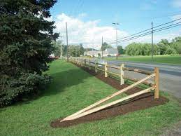 We installed a split rail fence in an. Split Rail Fence Driveway Fence Fence Landscaping Front Yard Fence