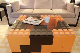 Existing of a table, salon table, standing lamp, plant pot, big screen tv (with stands) and sofa. Giant Lego Bricks For Home Decor And Construction
