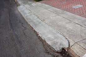 Our driveway is half asphalt and half concrete. Concrete Driveway Curb Ramps Pros And Cons Bridjit Curb Ramps