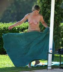 Edith Bowman topless on a beach