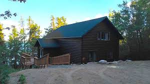 A futon in the living room provides extra sleeping room. Ely Mn Lodging Resorts Fishing Cabins