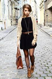 Dress down a printed dress by layering it over a turtleneck and tights and—that's right—slipping into a pair of combat boots instead of heels. Fall Dresses With Boots Fashion Style Autumn Fashion
