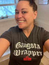 Wrapping presents while wearing a festive shirt