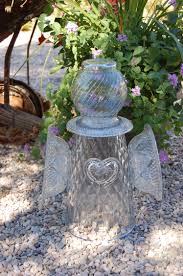 Pin By Stephanie Kuchinsky On Upcycled Art Glass Garden Art Glass Garden Flowers Yard Art