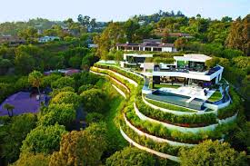 Inspiration for a contemporary garden in london with a water feature and gravel. 70s Home Transformed Into Modern Beverly Hills Masterpiece