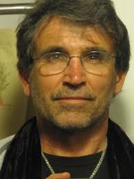 His name is Alan Watts. Be here now is the message.