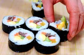 Kimbap Is One Of Korea S Most Iconic Snacks It Can Be Described As Cooked Rice Vegetables And Meat Rolled In Gim Seaweed Sheets Kimbap Gimbap Recipe Sushi