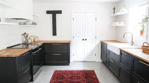 It creates a foundation while allowing the upper cabinets to be light and blend in with what is often white walls. Kitchens With Black Cabinets