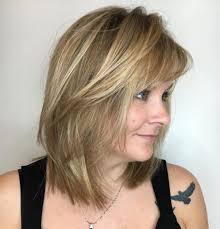 Medium length hair is perfect for women who don't want short hair but can't handle long hair. 80 Best Hairstyles For Women Over 50 To Look Younger In 2020