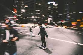 Handpicked blurry images and backgrounds. Wallpaper Id 221219 Blurry Photo Of A Man On Skateboard In Black Jacket Near An Intersection In A City Skateboard Intersection 4k Wallpaper