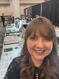 Displaying Imperial Commissary Collectors Convention pins and coins