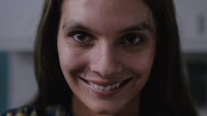 Smile Scares Up Chills, But Is Hampered by Cliches