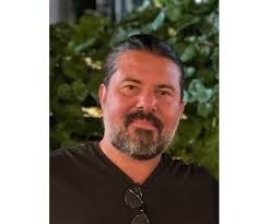 John Clark-Ginnetti Obituary (1977