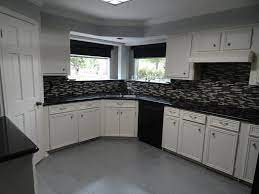 Once you're done with all the coats, use a foam roller to smooth out the paint and erase any brush marks. Kitchen Glass Mosaic Tile Floor Tile Paint Before And After Modern Kitchen Houston By Painting Services By Steve Houzz