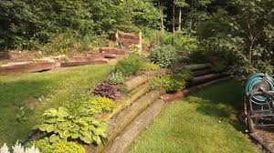 Recycled Telephone Pole Retaining Wall Landscaping Retaining Walls Backyard Landscaping Diy Lawn