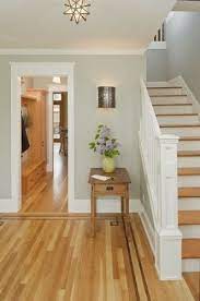 Light gray walls with white trim and wood floors. Lovely Entry With Light Grey Walls White Trim And Hardwood Paint Colors For Living Room Light Oak Floors Hardwood Floor Colors