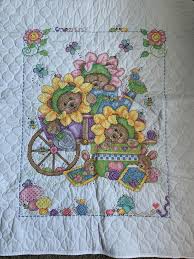 This cross stitch book features a dozen lighthouses from the us and canada that can be stitched together on an afghan or displayed individually: Fo Finished A Baby Blanket Started By My Grandma Full Story In Comments Stamped Blanket Called Baby Garden By Janlynn Crossstitch