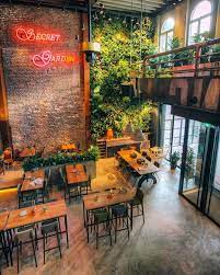 A Secret Garden With Our Beautiful Vertical Garden In The Cozy Restaurant De Voo Bistro Design Modern Restaurant Design Cafe Interior Design