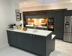 Create a cosy and inviting room with our allendale slate grey kitchen and…» dark shaker kitchen with white worktops and brass hardware. Brian Lynne Bespoke Hand Built Kitchens By Hb Kitchens