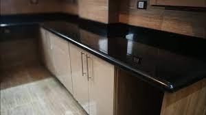 The stone's warm creamy background features brown and black flecks and veins. Black Galaxy Star Granite Kitchen Countertop Ammar Company Youtube