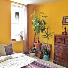 Opt for matching edges, hemlines or pipings on the bedding or scatter miniature objects such as a pretty yellow lampshade, a yellow flower vase or wooden shelf around the room to bring this look to a beautiful conclusion. Yellow Bedroom Wall Paint Colour Yellow Bedroom Decor Yellow Bedroom Walls Yellow Room