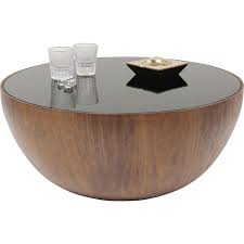 Use artistic techniques to design the look, such as striking a balance with symmetry and composing a color story or style. Coffee Table Tear Drops Walnut O80cm Kare Design