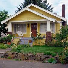 Wood, stone and brick, heavy trim, corbels, beams and tapered or squared entry. What Is A Craftsman House