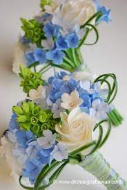 If she carried a bouquet, it almost always. Blue Hydrangeas Bells Of Ireland And White Roses Bride Bouquets White Wedding Flowers Wedding Flowers