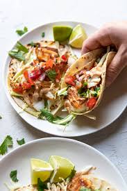 This kind of fish taco is either grilled or fried and topped with either a creamy or vinegar based slaw. Blackened Cod Fish Tacos With Fish Taco Sauce Modern Crumb