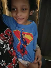 Child with autism overcoming clothing anxiety with robe