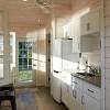 The bluestone flooring flows in from the pool terrace, blurring the boundaries of interior and exterior space. 1