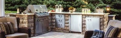 A natural stone fire pit is comprised of a firebrick interior and is topped with pennsylvania bluestone. Outdoor Kitchens And Fire Pits Gas Fuel Sinks Brick Nj