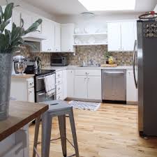 Diy remodeling expert fuad reveiz shows how to lay ceramic tiles over a laminate countertop and how to install a tile backsplash to match the new countertop. Remodelaholic Kitchen Mini Makeover With Affordable Tiled Diy Marble Countertops And Aged Copper Light Fixture