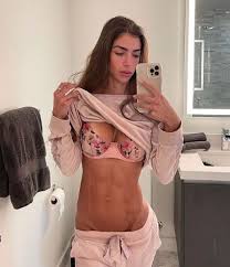 That's a lot of fans! Fitness Model Cheekily Lifts Up Top To Show Off Hard Rock Abs In Sexy Expose Daily Star