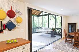 The first step in any flagstone patio conversion is deciding how you're going to get footers underneath that existing patio. Convert Screened Porch To Sunroom Owings Brothers Contracting